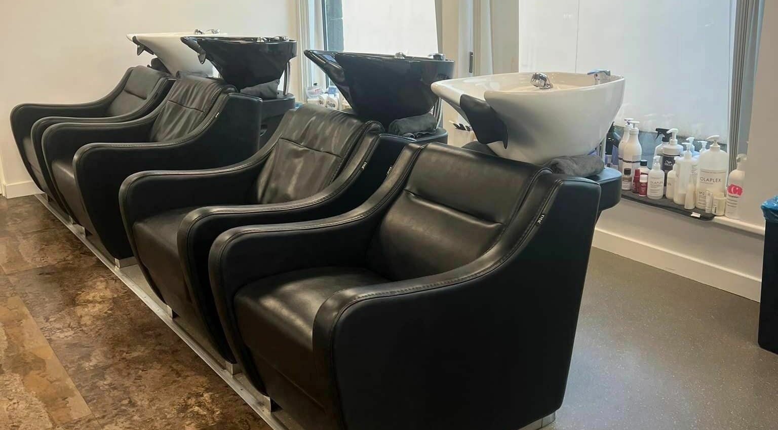 Luxurious wash chairs at Macie's in Guernsey, Castel, GG for premium hair care experience.