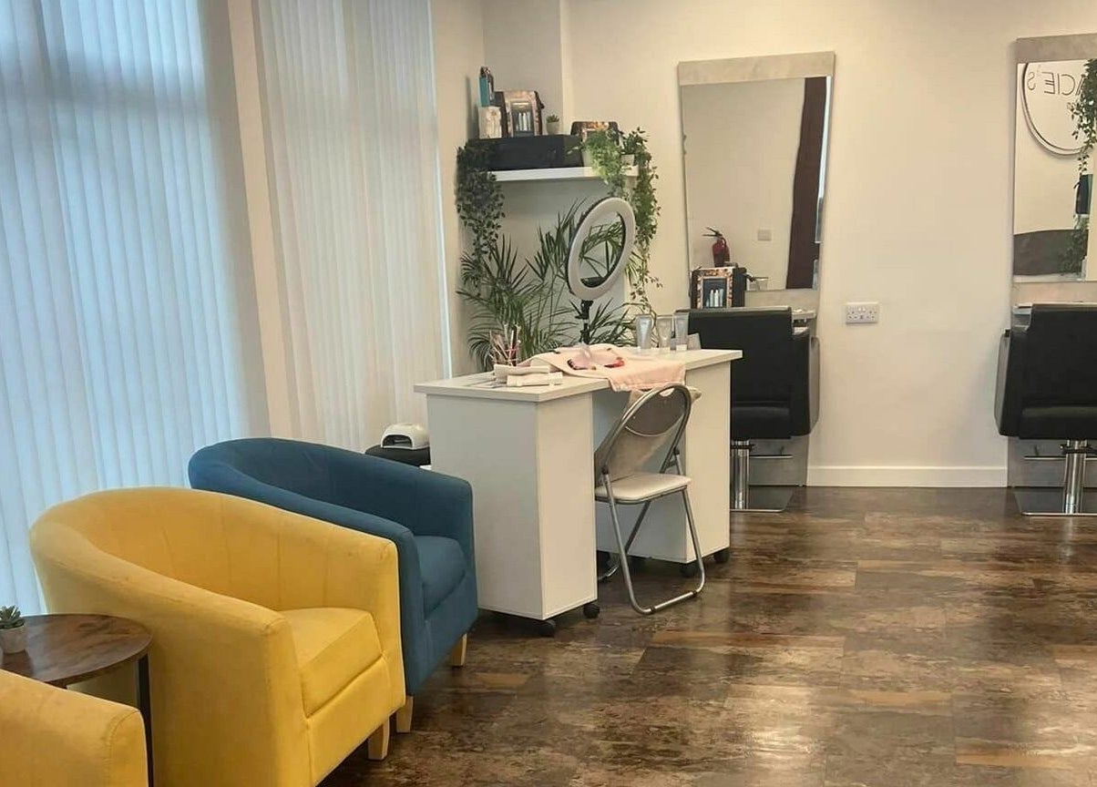 Modern beauty salon at Macie's, Guernsey, Castel, GG with colorful seating and styling stations.