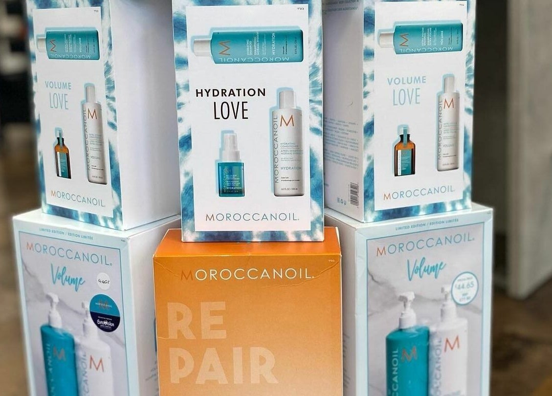 Stacked Moroccanoil products display at Macie's, Guernsey, Castel, GG, showcasing hydration and volume sets.