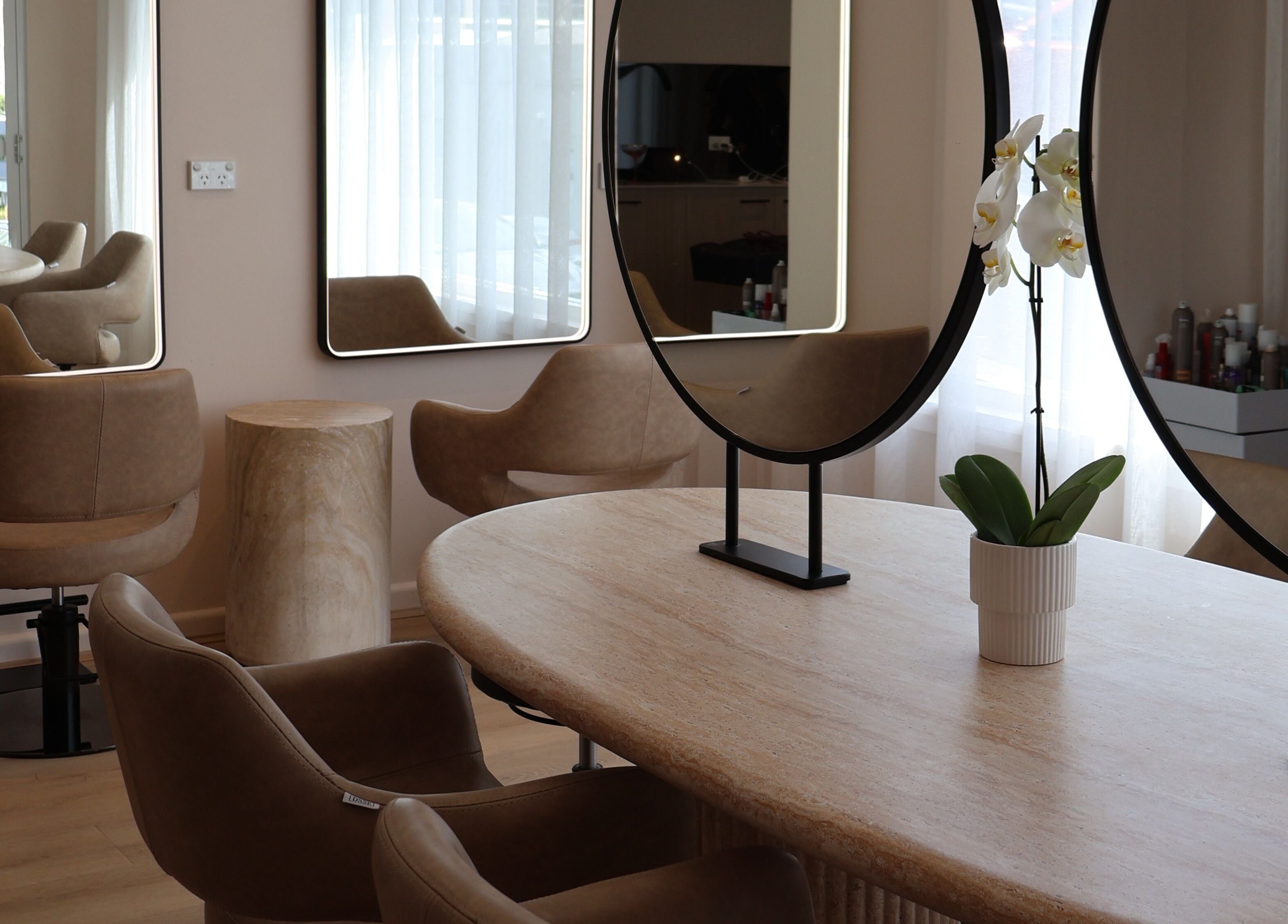Sleek salon interior with stylish chairs and mirrors at Lushed Beauty, Wollongong, New South Wales, AU.