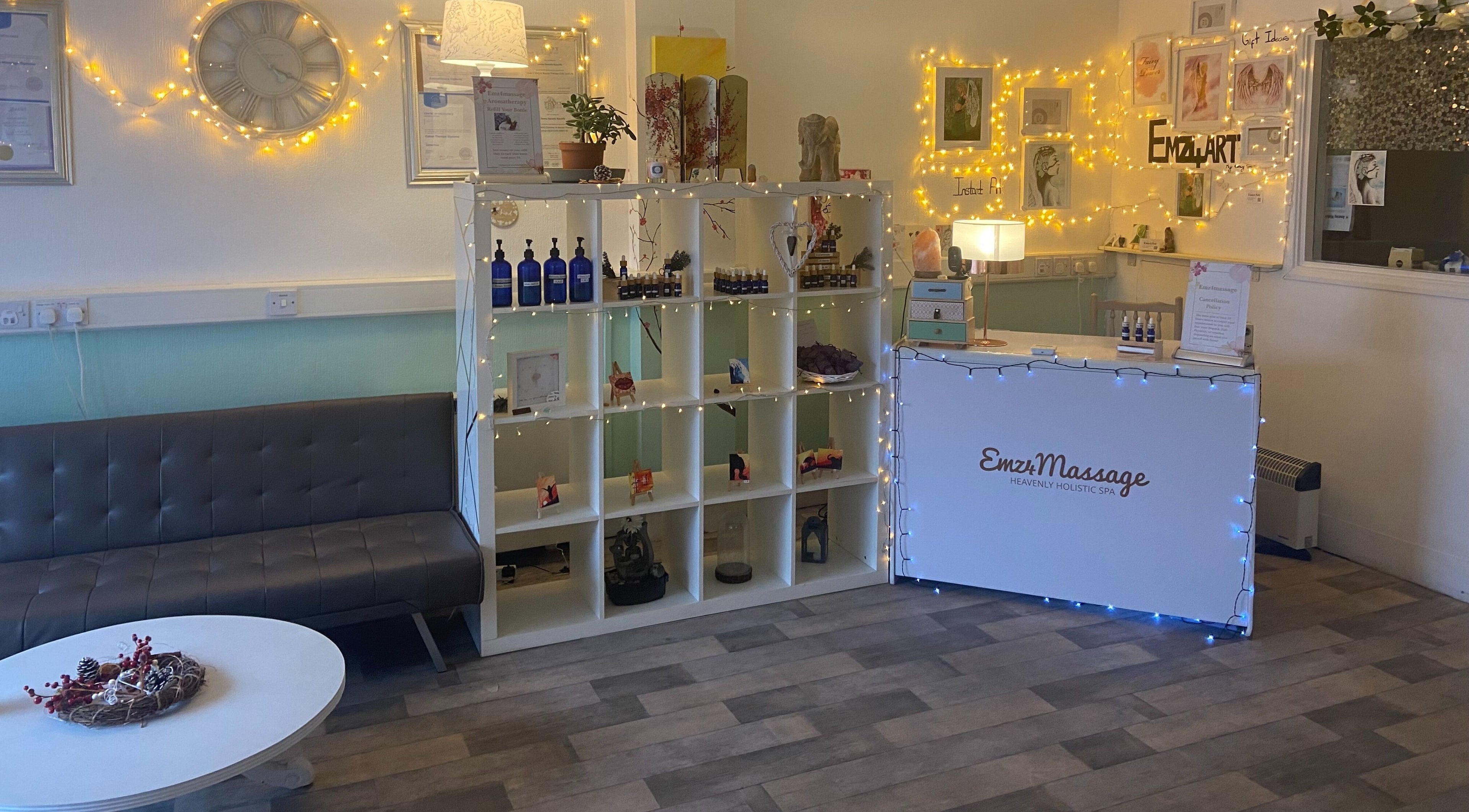 Cozy interior of Emz4massage in Ilkeston, England, GB with fairy lights and a welcoming reception desk.