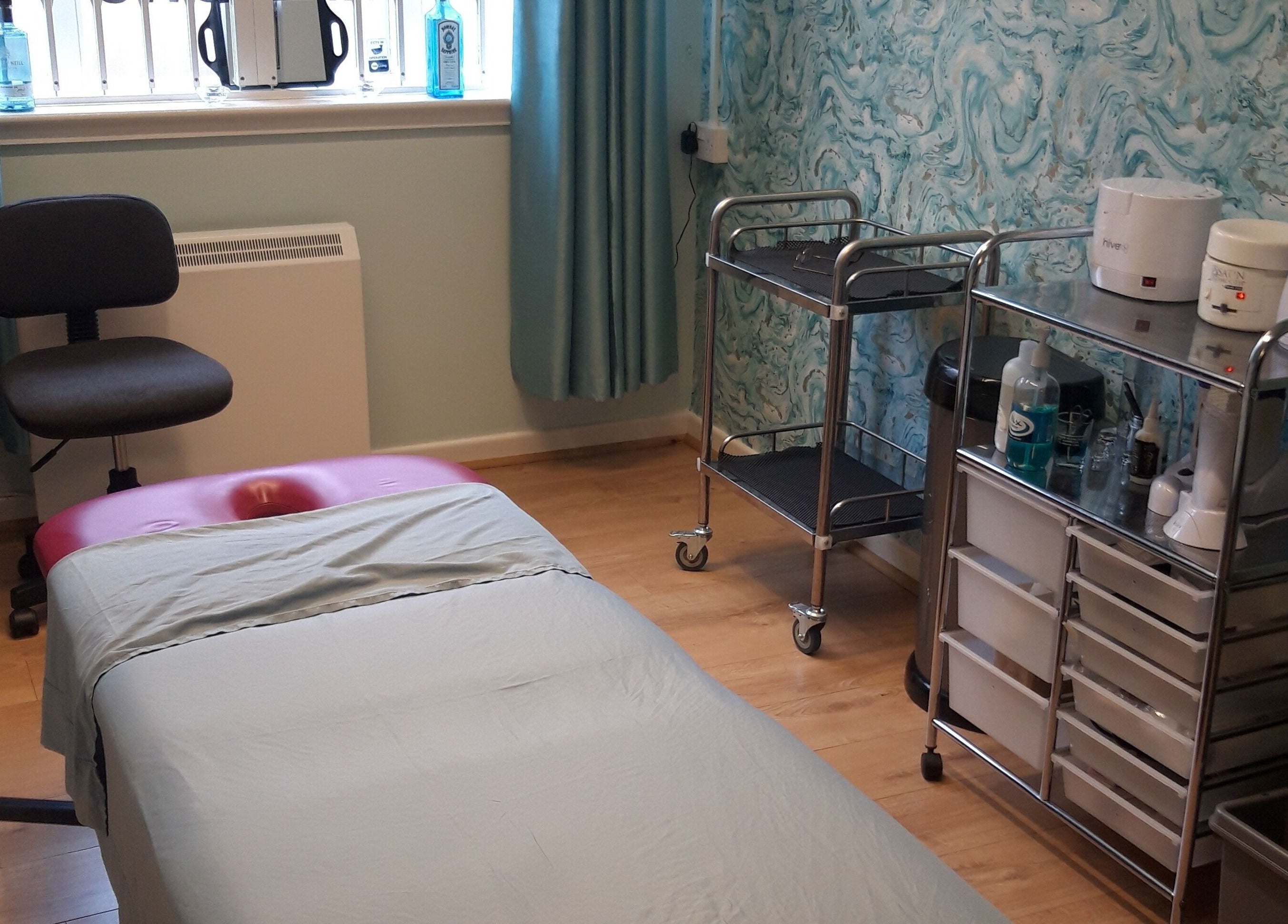 Therapy room at The Hub New Mills, New Mills, England. Features a treatment bed and wellness equipment.