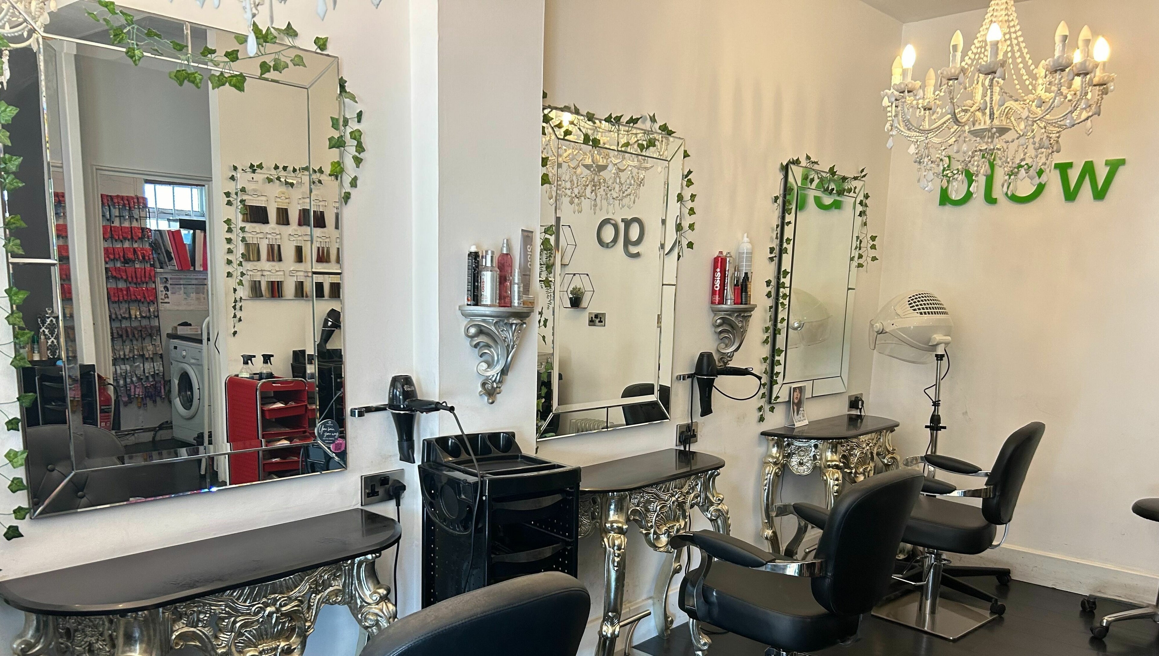 Elegant styling area at SY2 The Salon in Shrewsbury, England, GB, featuring ornate mirrors and chic furnishings.