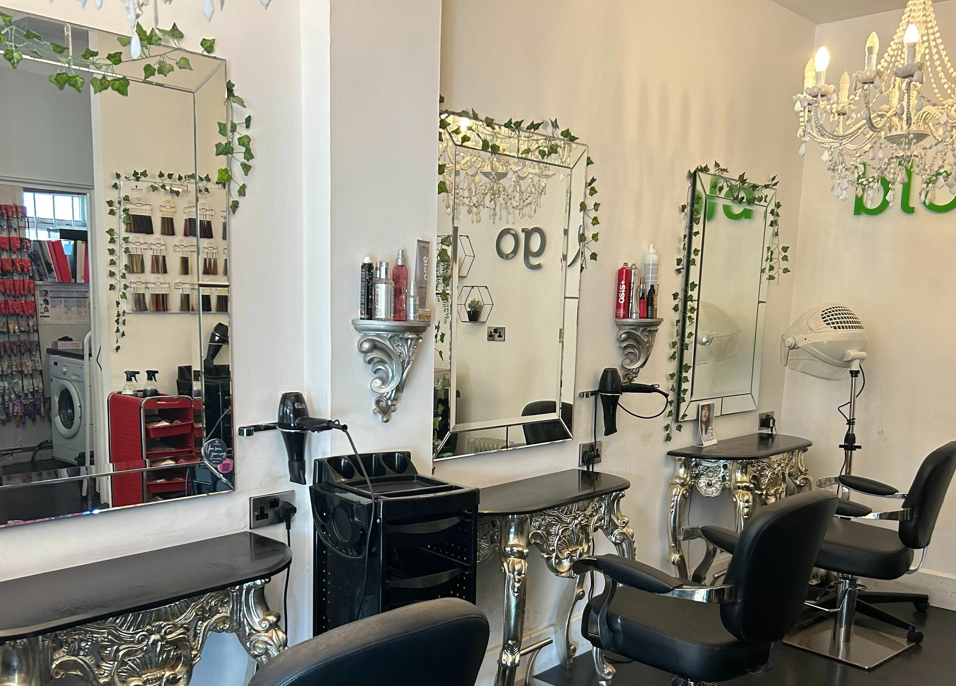 Elegant styling area at SY2 The Salon in Shrewsbury, England, GB, featuring ornate mirrors and chic furnishings.