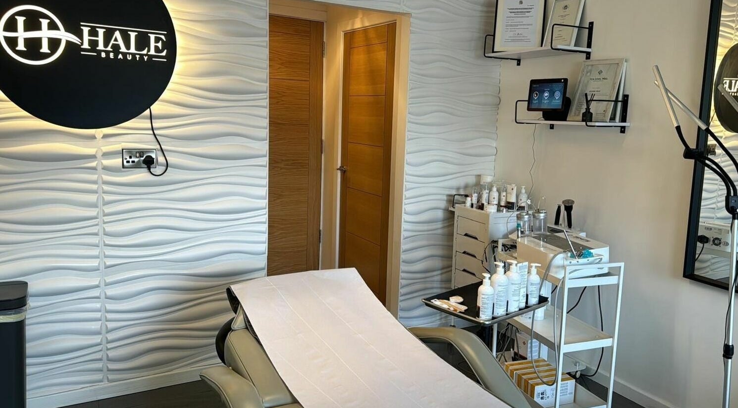Hale Beauty treatment room in Sutton Coldfield, England. Modern decor with skincare products visible.