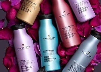 Colorful Pureology bottles surrounded by petals at Liz Cotter Styling, County Galway, County Galway, IE.