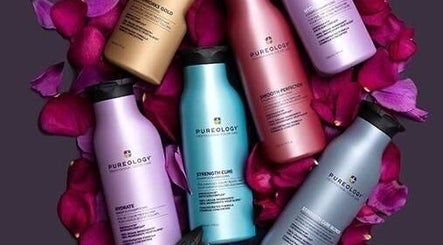 Colorful Pureology bottles surrounded by petals at Liz Cotter Styling, County Galway, County Galway, IE.