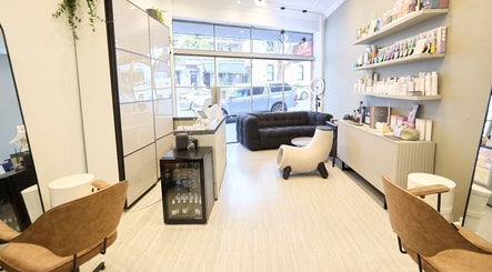 Modern interior of KSHD (Kota Sato Hair Design) in Surry Hills, New South Wales, AU, featuring stylish seating.