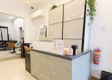 Reception area of KSHD (Kota Sato Hair Design) in Surry Hills, New South Wales, AU with stylish decor.