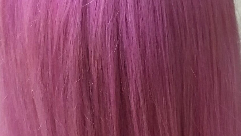 Vibrant pink hair showcasing color treatment at Gypsy Santa Fe, Santa Fe, New Mexico, US.