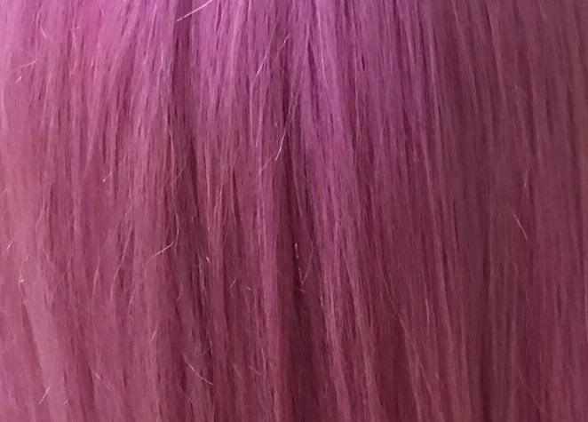 Vibrant pink hair showcasing color treatment at Gypsy Santa Fe, Santa Fe, New Mexico, US.