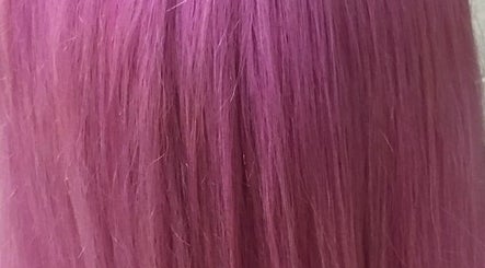 Vibrant pink hair showcasing color treatment at Gypsy Santa Fe, Santa Fe, New Mexico, US.
