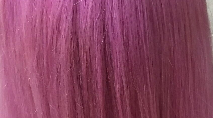 Vibrant pink hair showcasing color treatment at Gypsy Santa Fe, Santa Fe, New Mexico, US.