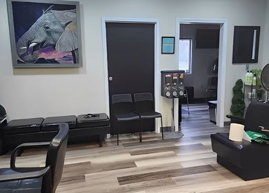 Relaxing seating area at Haven Hair Salon, East Haven, Connecticut, US showcasing sleek, modern decor.