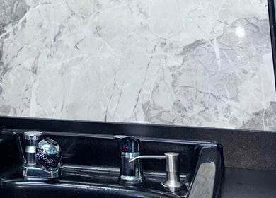 Elegant wash station with marble backdrop at Haven Hair Salon, East Haven, Connecticut, US.