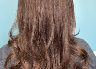 Lustrous wavy brown hair styled at Haven Hair Salon in East Haven, Connecticut, US.