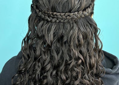 Intricate braided hairstyle from Haven Hair Salon in East Haven, Connecticut, US, showcasing wavy curls.