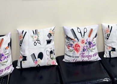 Stylish pillows with salon-themed prints at Haven Hair Salon, East Haven, Connecticut, US.