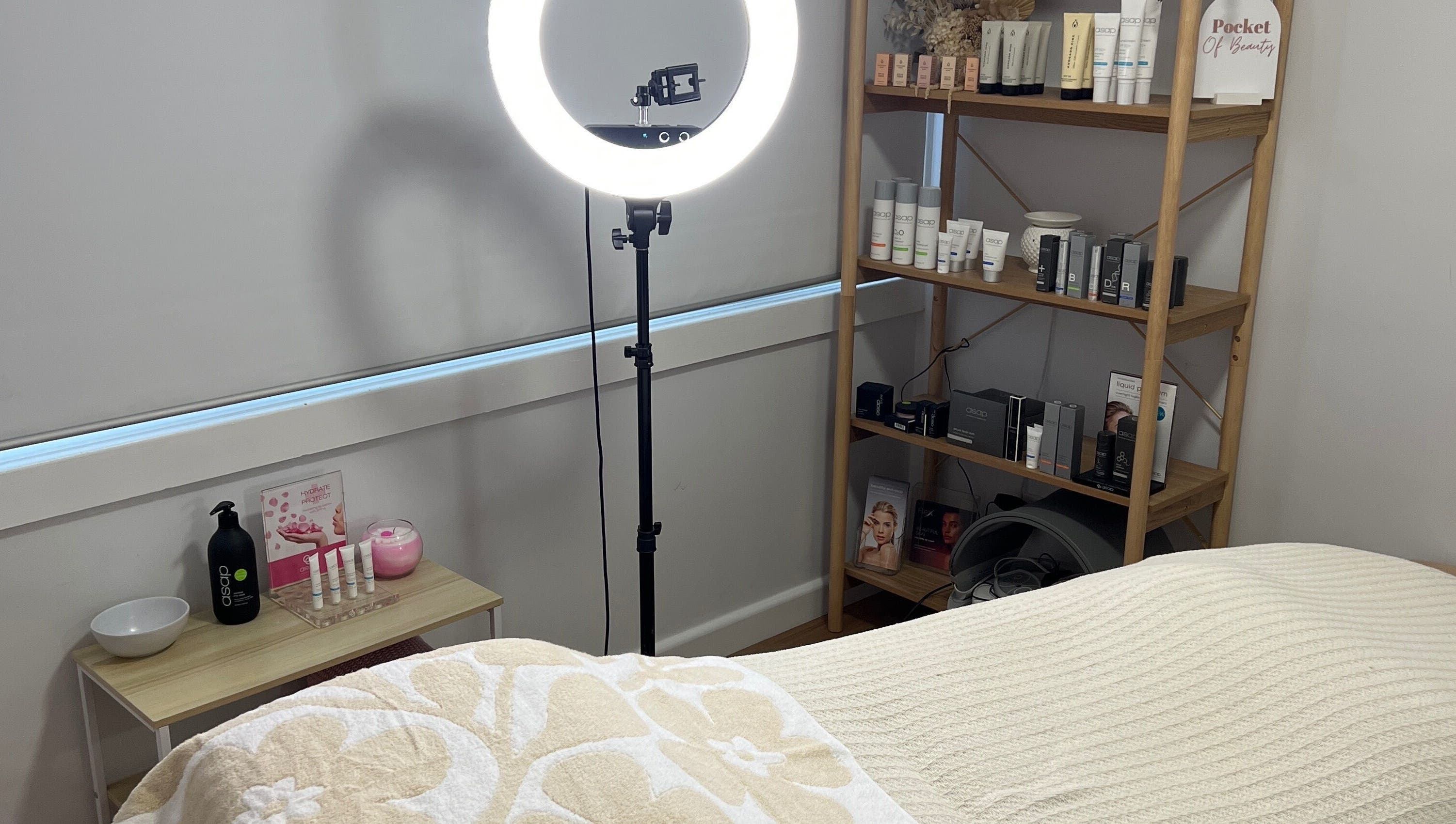 Cozy room at Pocket Of Beauty, West Wallsend, NSW, featuring skincare products and a gentle, relaxing ambiance.
