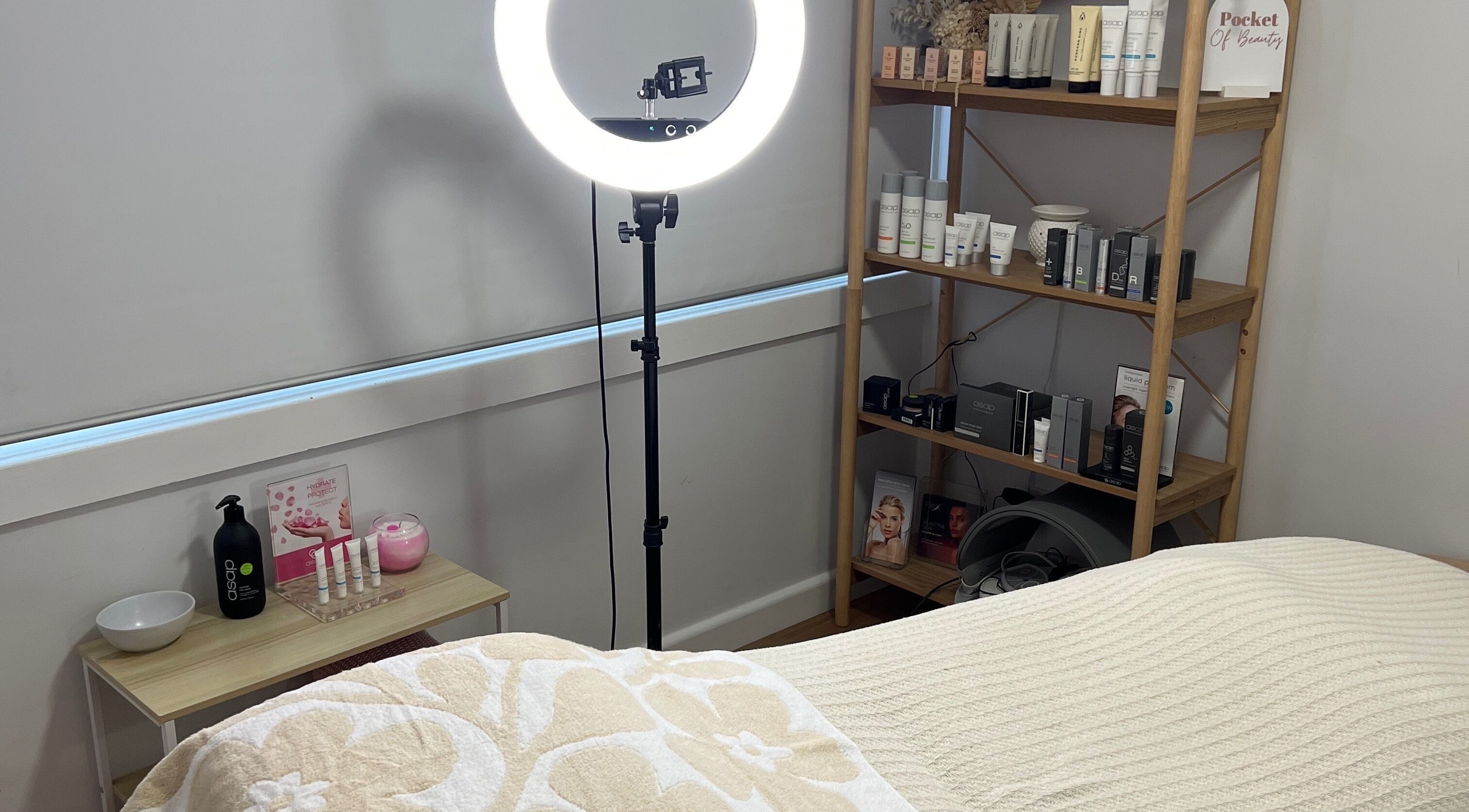 Cozy room at Pocket Of Beauty, West Wallsend, NSW, featuring skincare products and a gentle, relaxing ambiance.