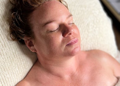 Relaxed woman enjoying a facial at Pocket Of Beauty, West Wallsend, New South Wales, AU.