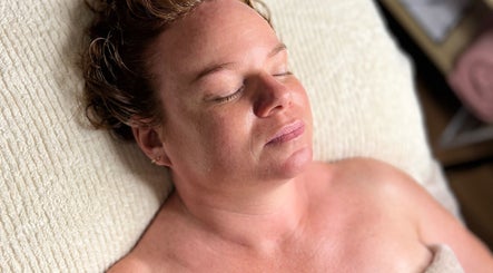 Relaxed woman enjoying a facial at Pocket Of Beauty, West Wallsend, New South Wales, AU.