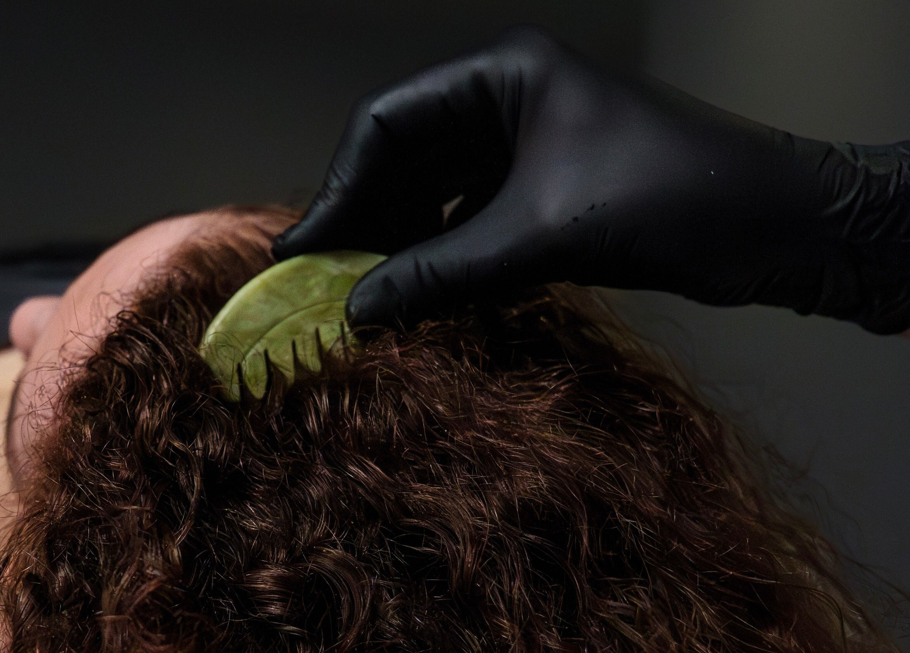 Gua sha jade comb hair massage at Socair Centre, Oban, Scotland, GB for relaxation and wellness.