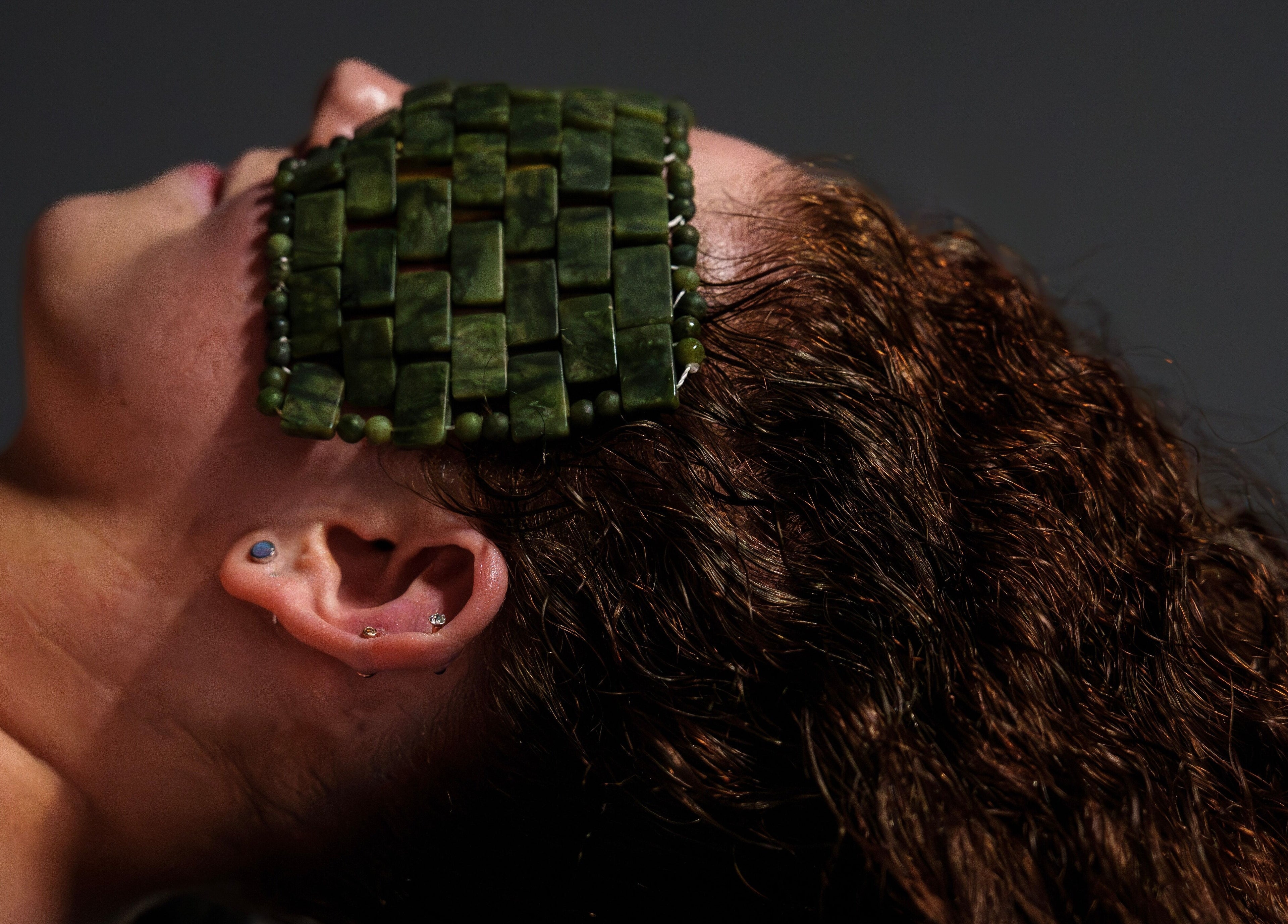 Relaxing with a jade eye mask at Socair Centre, Oban, Scotland, GB. Enhancing tranquility and well-being.