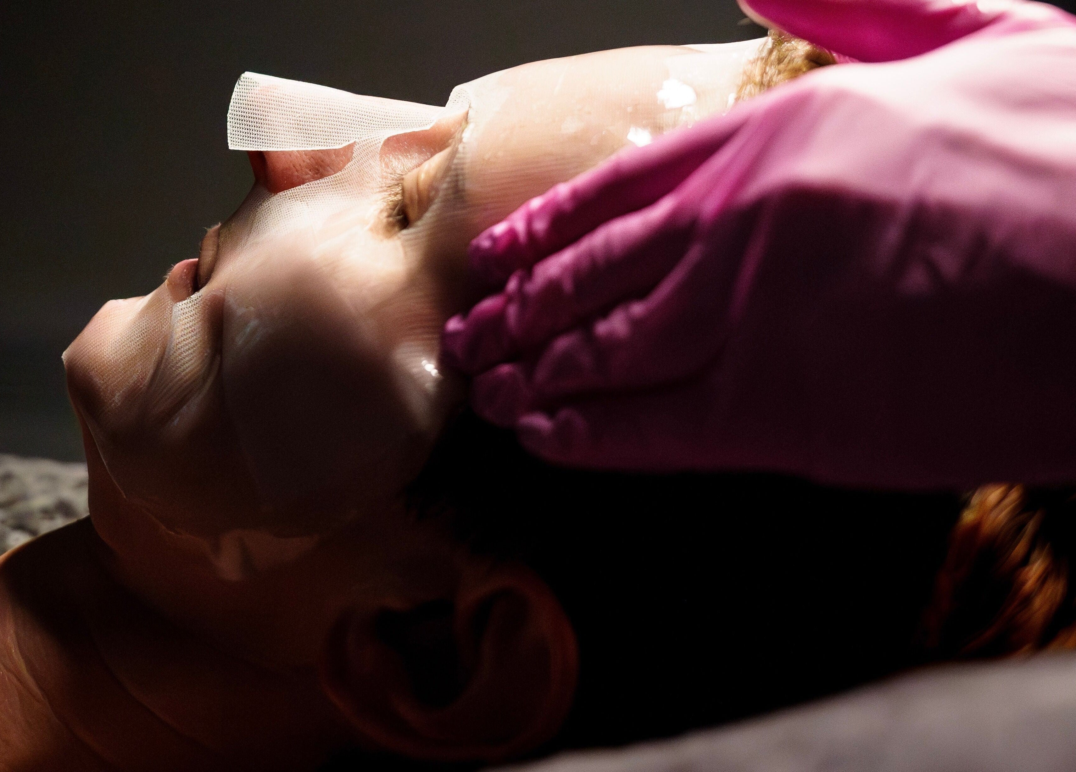 Facial treatment at Socair Centre, Oban, Scotland, GB. Gentle hands applying mask for rejuvenation.