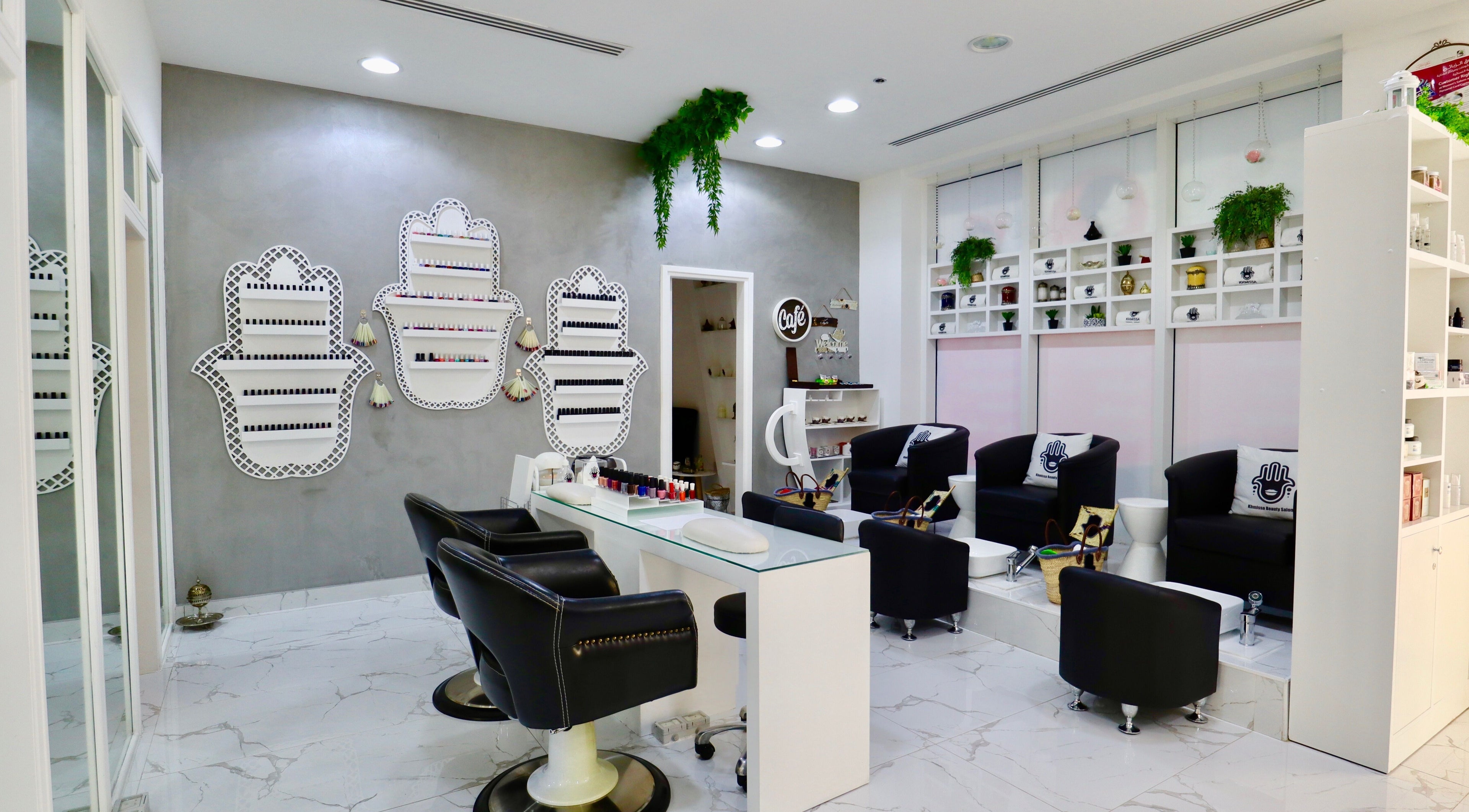 Modern interior of Khmissa Beauty Salon in Dubai, Dubai, AE with stylish decor and luxurious seating.