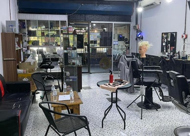 MTB Barbershop and Academy interior in Langkawi, Kedah, MY featuring modern barber chairs and mirrors.