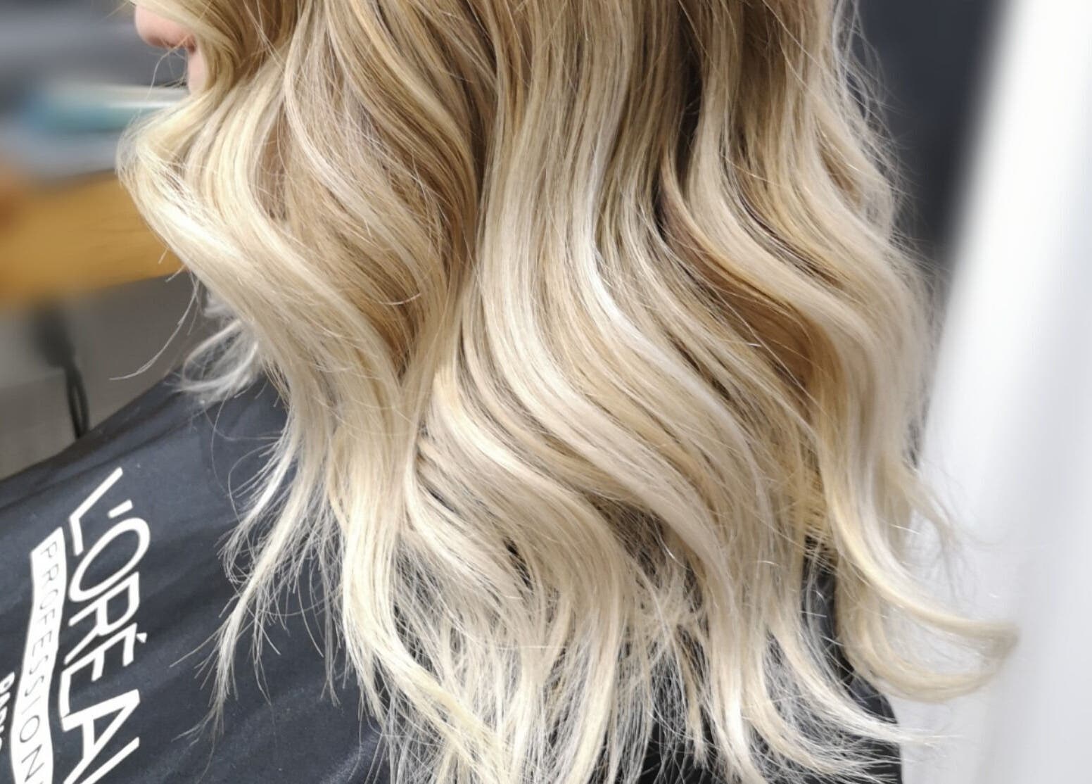 Blonde wavy hairstyle at Hair Studio Midland in Midland, Ontario, CA.