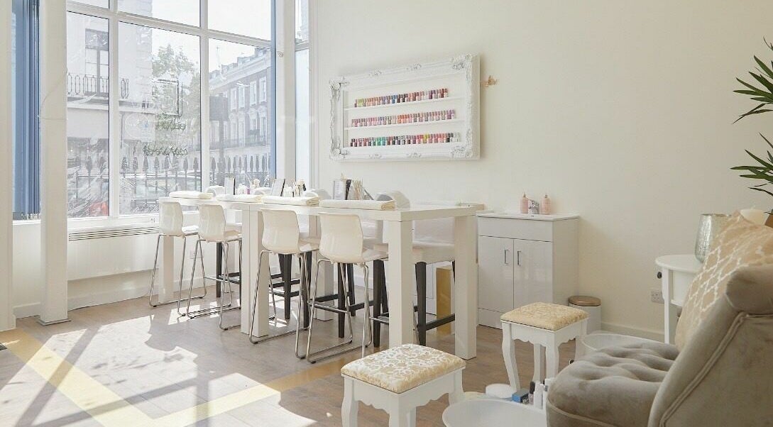 Bright, stylish nail bar interior at Thirty Four Nails, London, England, GB. Modern decor and ample natural light.
