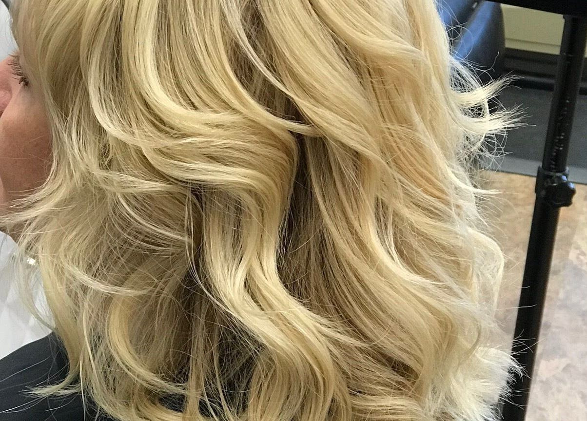 Chic blonde hairstyle at Alluring Locks, Mount Carmel, Illinois, US. Capturing modern blonde styling.