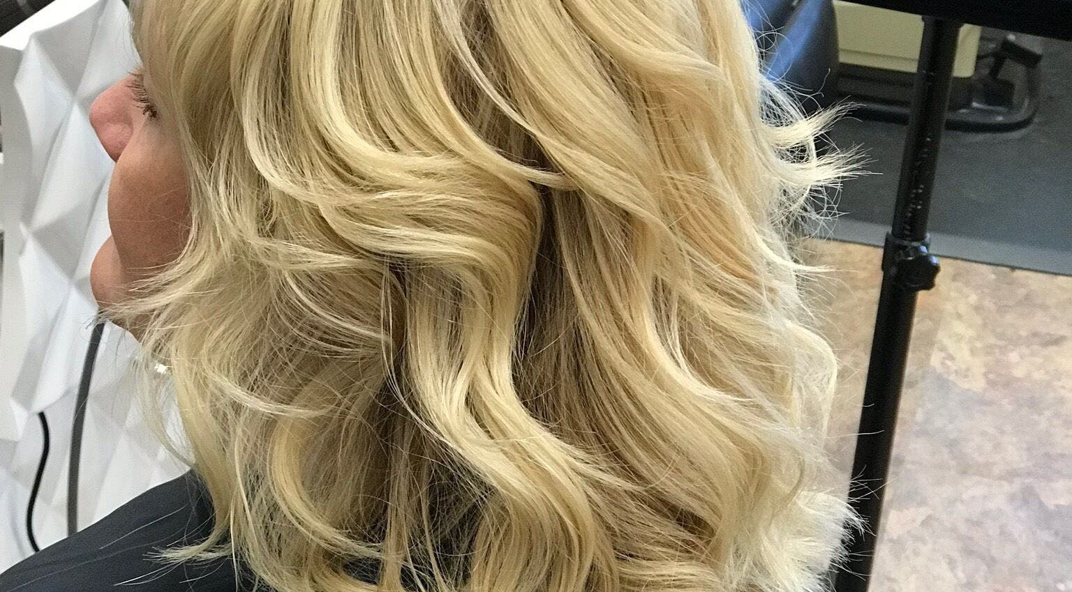 Chic blonde hairstyle at Alluring Locks, Mount Carmel, Illinois, US. Capturing modern blonde styling.