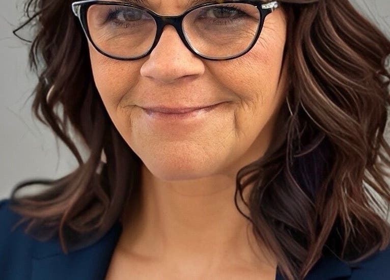 Stylish woman with glasses at Alluring Locks, Mount Carmel, Illinois, US, showcasing luxury hair style.