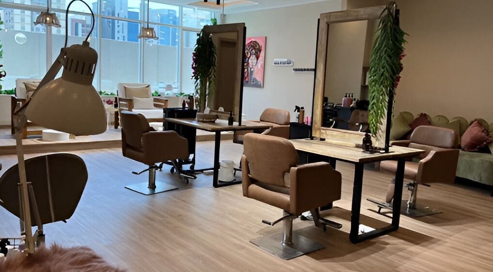 Modern salon chairs and mirrors at Ilios Ladies Salon LLC, Dubai, AE, create an inviting and stylish atmosphere.
