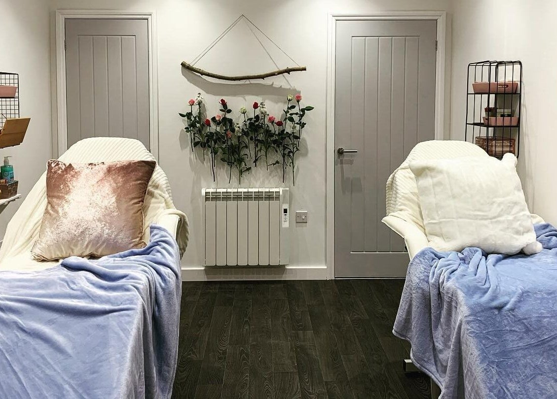Luxury treatment rooms at Elite Beauty and Spa in Kent, England, GB, featuring plush blankets and elegant decor.