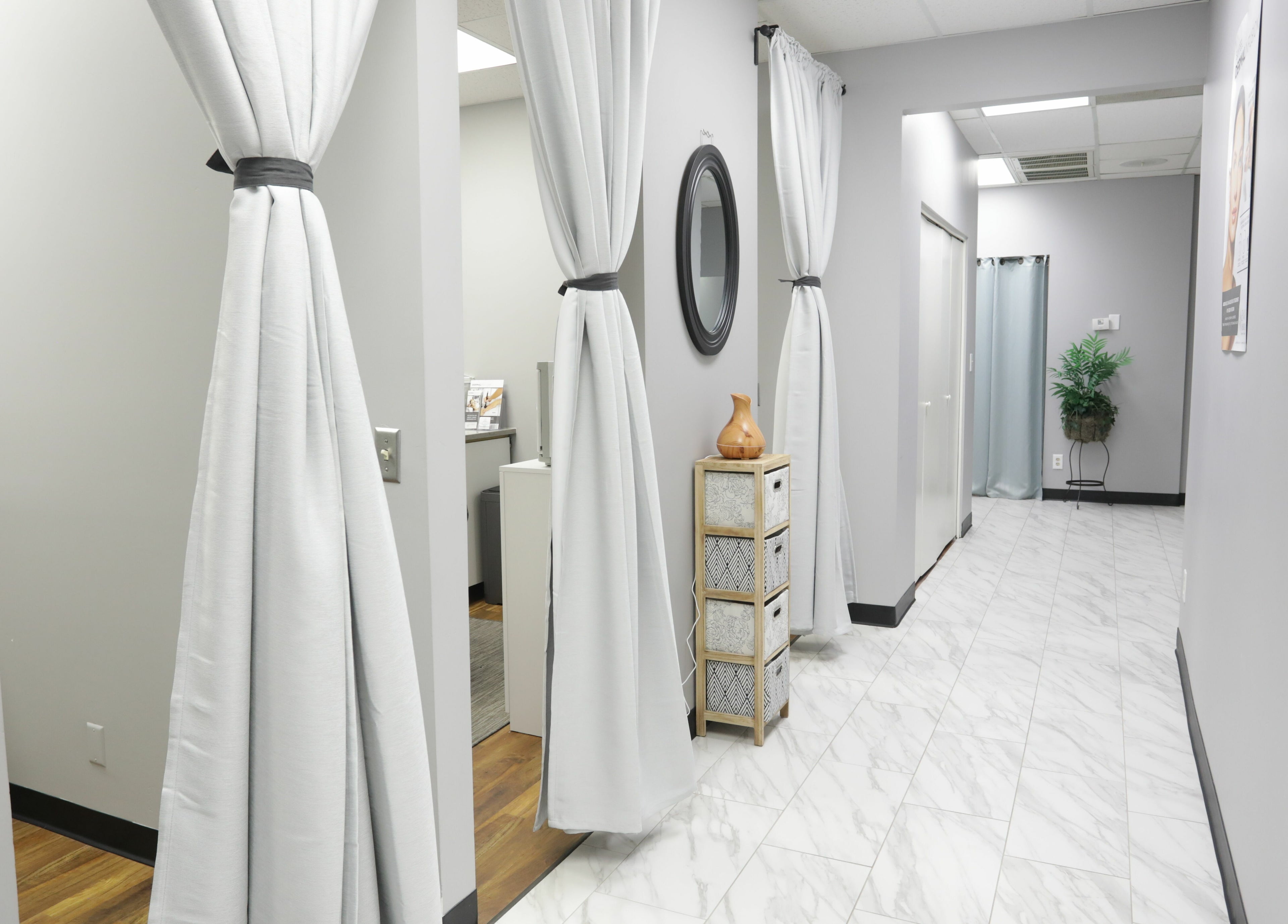 Bright hallway at Pure MedSpa in Gilbert, Arizona, US with elegant drapes and decor.