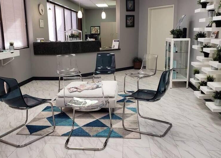 Stylish waiting area at Pure MedSpa in Gilbert, Arizona, US, featuring modern chairs and decor for inviting ambiance.