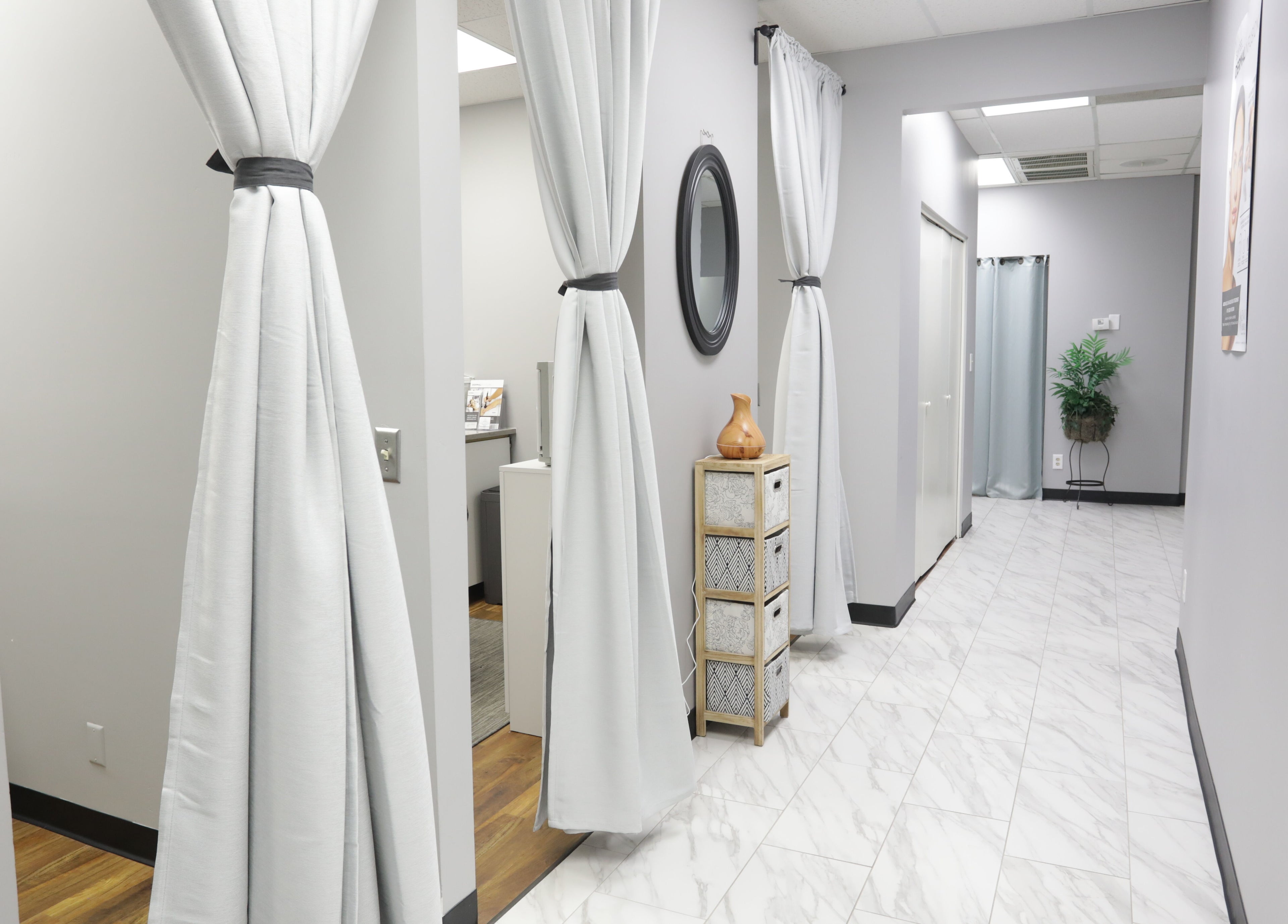 Elegant corridor with white curtains at Pure MedSpa, Gilbert, Arizona, US, showcasing a serene ambiance.