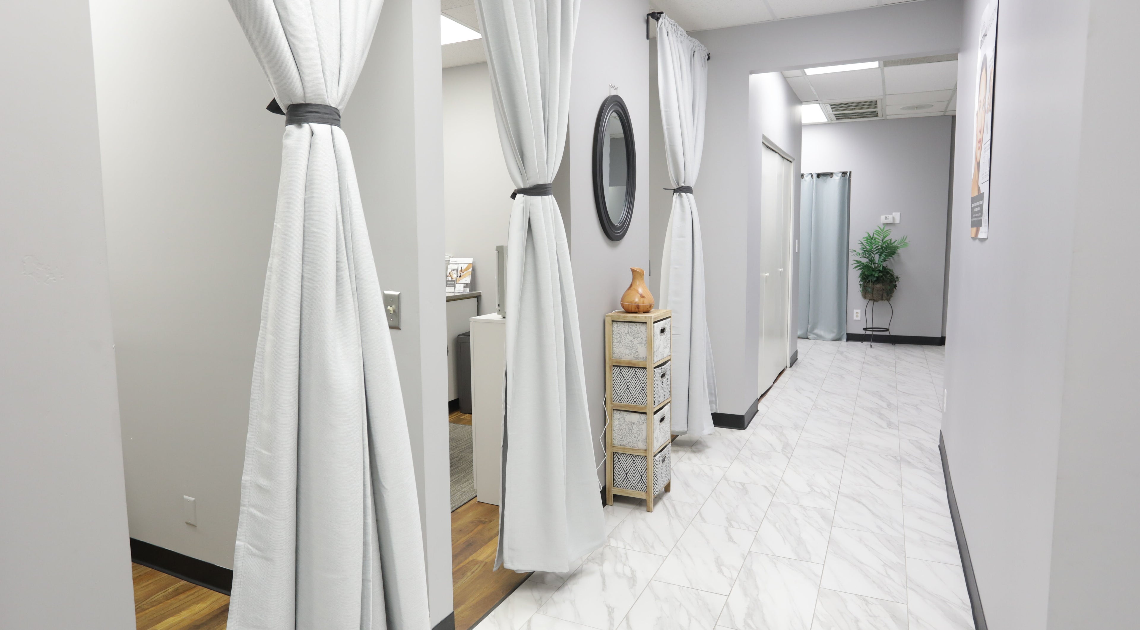 Elegant corridor with white curtains at Pure MedSpa, Gilbert, Arizona, US, showcasing a serene ambiance.