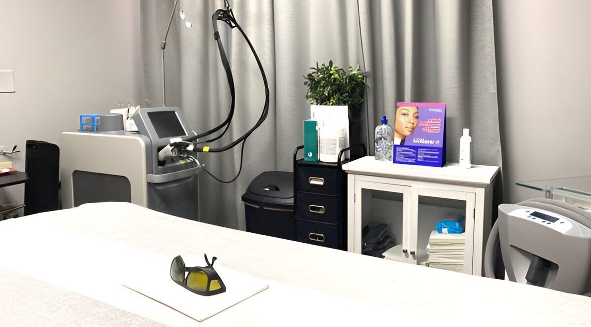 Modern spa treatment room at Pure MedSpa, Gilbert, Arizona, US featuring advanced laser equipment and ambient decor.