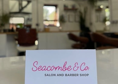 Seacombe & Co. salon interior in Chichester, England, GB with stylish decor and seating.