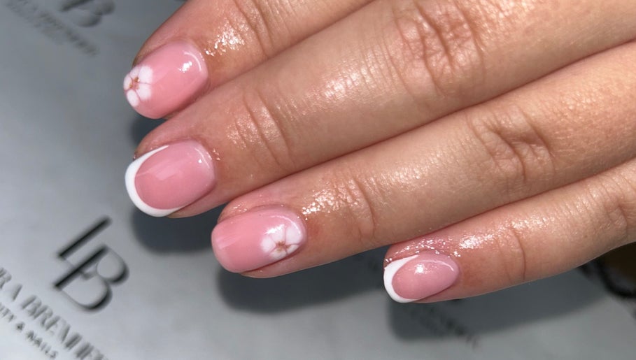 Elegant pink nails with floral design at Laura Bremner Nails and Beauty, Cardenden, Scotland, GB.