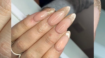 Elegant glitter-tipped nails at Laura Bremner Nails and Beauty, Cardenden, Scotland, GB.