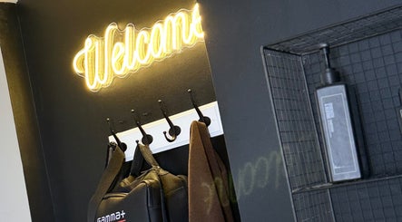 Marley Mayer Salon - Exmouth features a welcoming neon sign. Stylish interior decoration in Exmouth, England, GB.