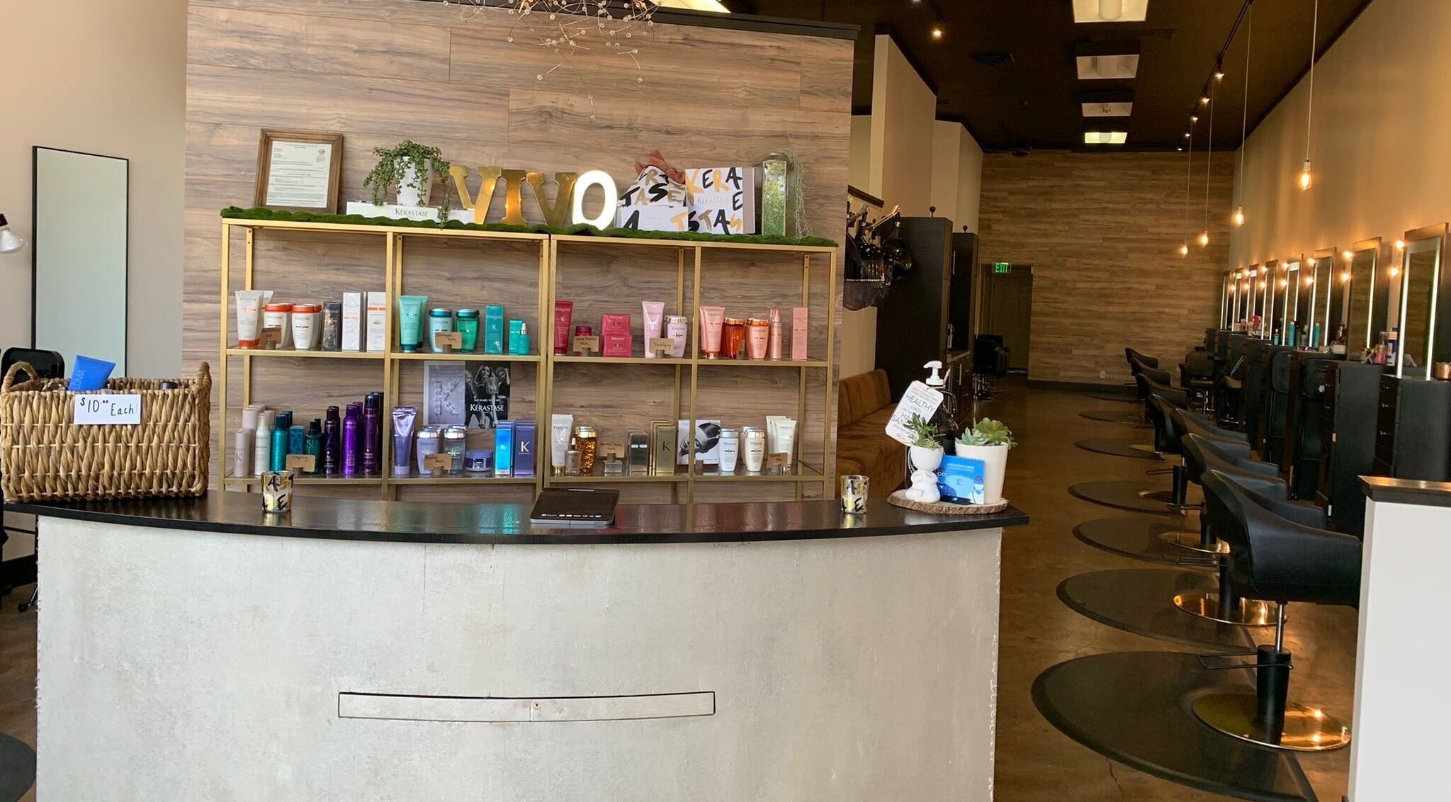 Elegant reception area at Adriana at Salon Vivo in San Carlos, California, US, showcasing hair care products.