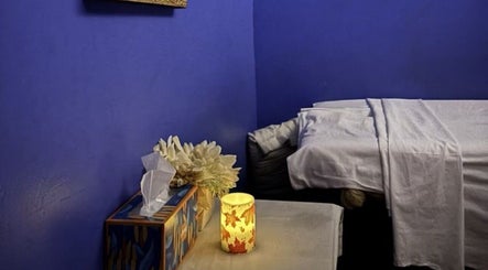 Peaceful massage room at Royal Thai Massage, Santa Barbara, California, with soft lighting and calming decor.