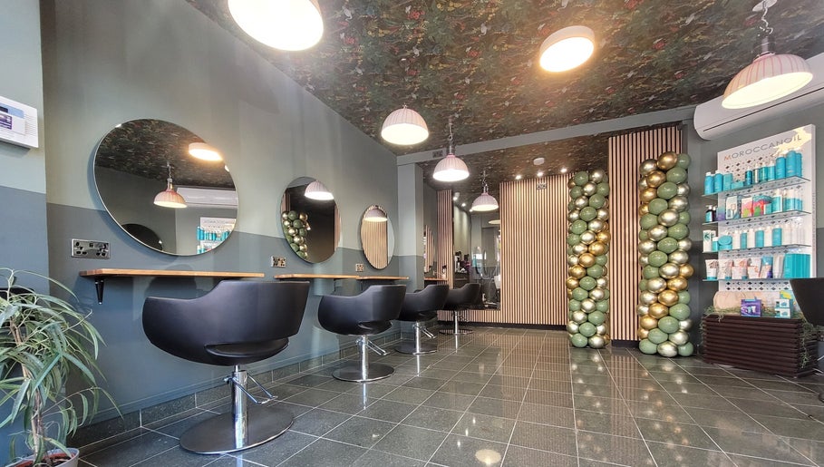 Modern interior of Gareth at Artistic Hair Co in Bristol, England, GB, featuring stylish chairs and elegant décor.